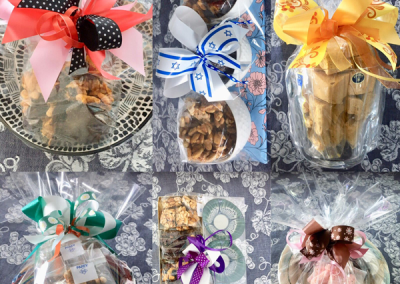 A collage of pre-packed and wrapped sweet kosher treats for jewish high holy days