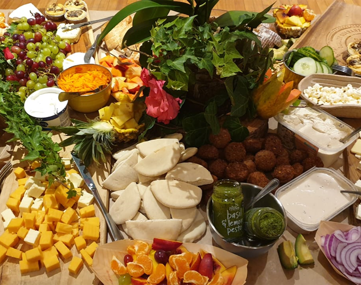  Kosher Jewish harvest table with fruit,cheese, fallafel and pita bread 