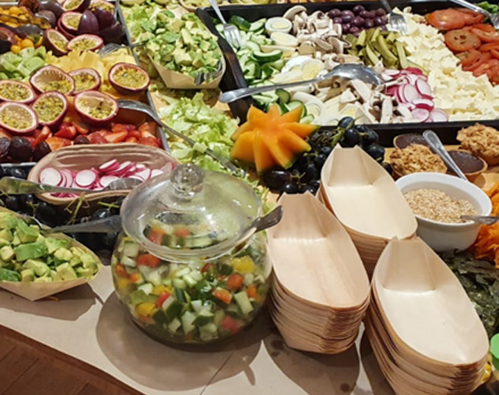  A kosher harvest table of pretty cut fruit and salads 